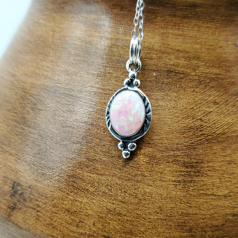 Pink Oval Opal pendant. Silver Chain