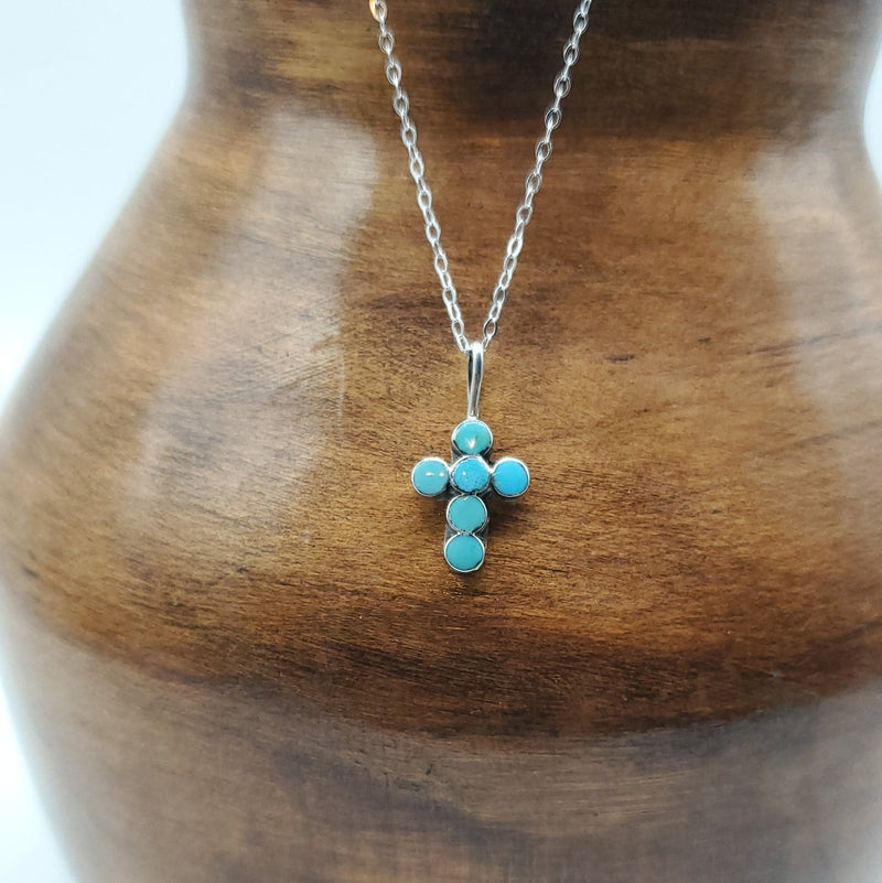 Small Turquoise with six round stones.  Silver chain included
